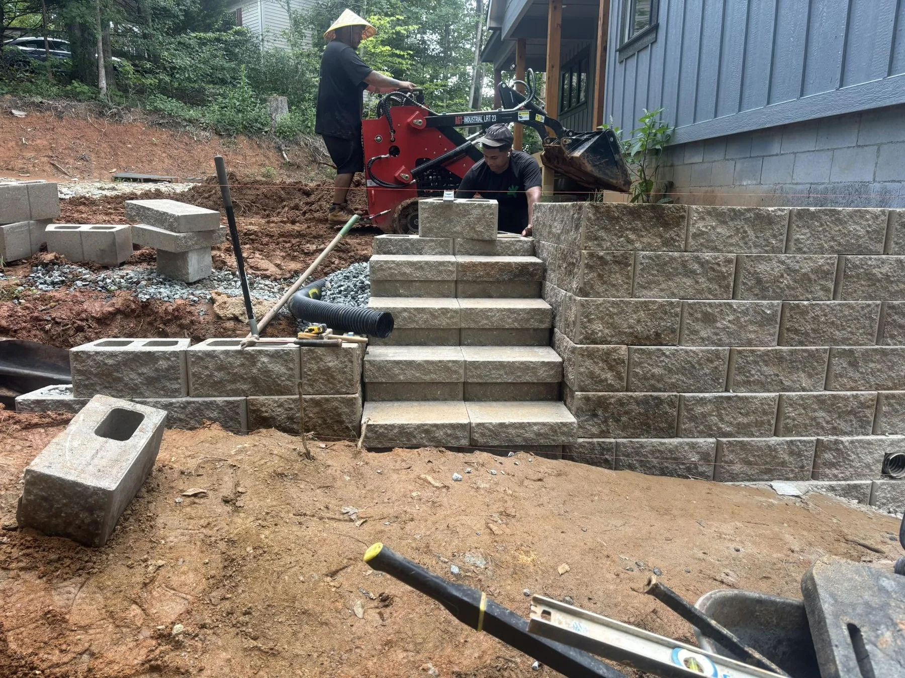 Infinite Outdoor Construction crew working on an outdoor project