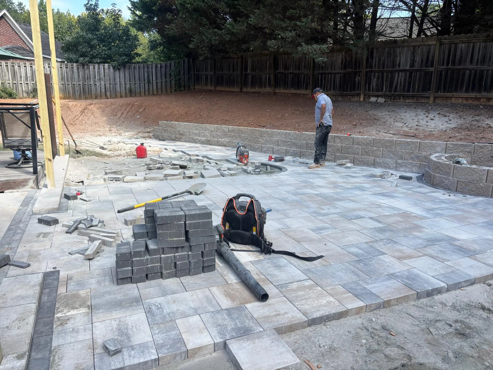 Large paver patio installation in progress