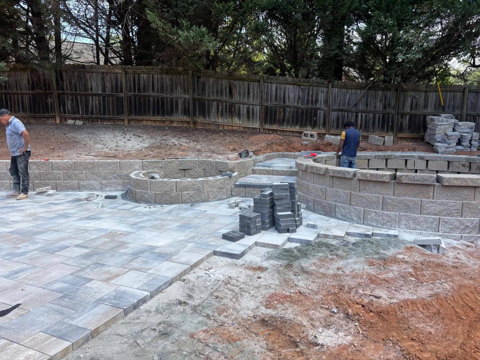 Paver patio combined with retaining wall construction