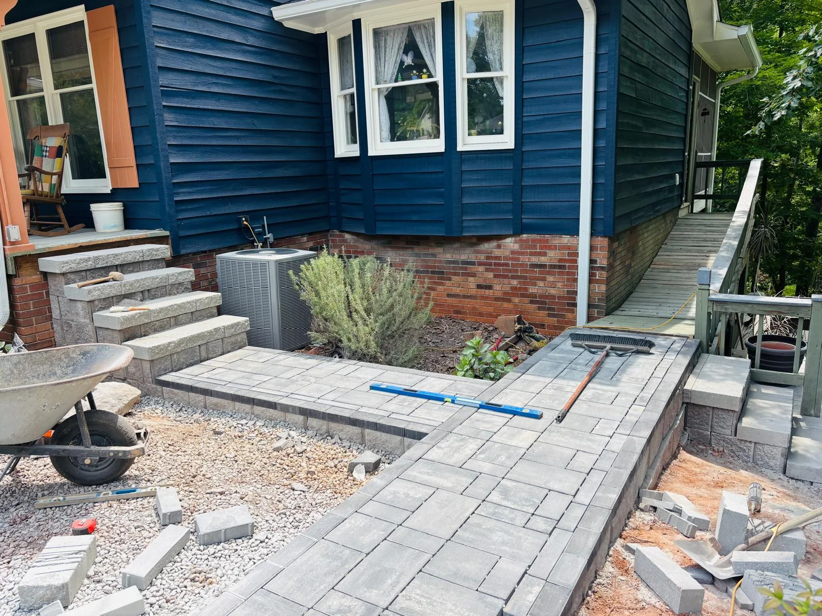 Paver walkway and steps installed beside a home